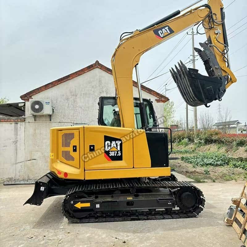 Second-hand Caterpillar 307 for sale, rear side view of a well-maintained used CAT 307 excavator with clean body and tracks.
