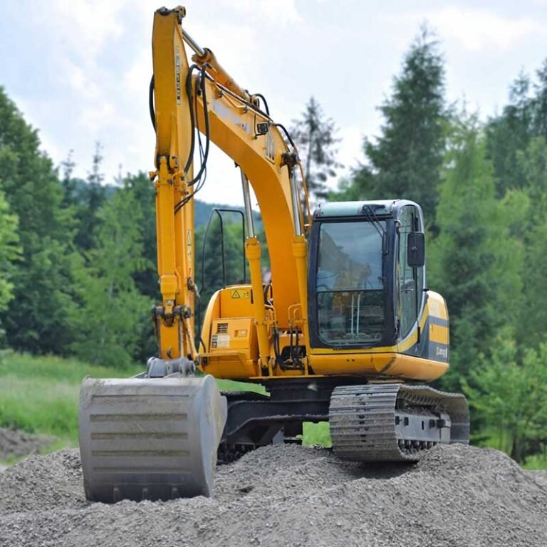 Front view of a Cat compact excavator with raised boom undergoing performance testing, highlighting key features of the best mini excavator for small projects.
