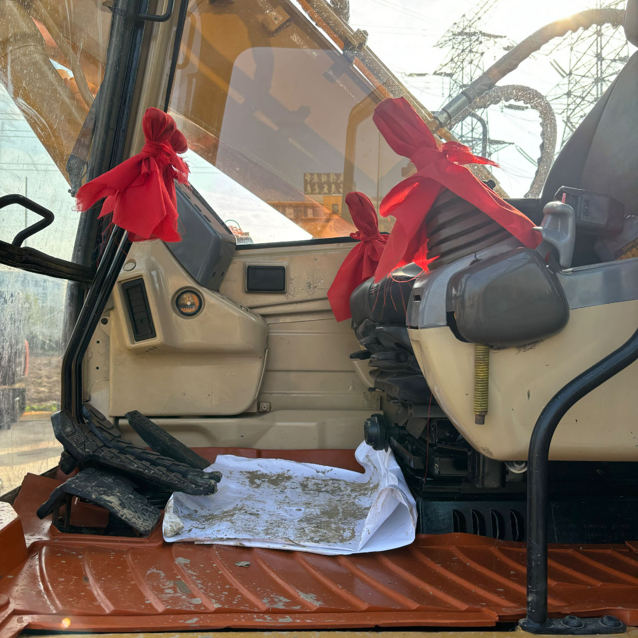 Operator cabin interior showcasing ergonomic controls related to Cat 320 excavator specs