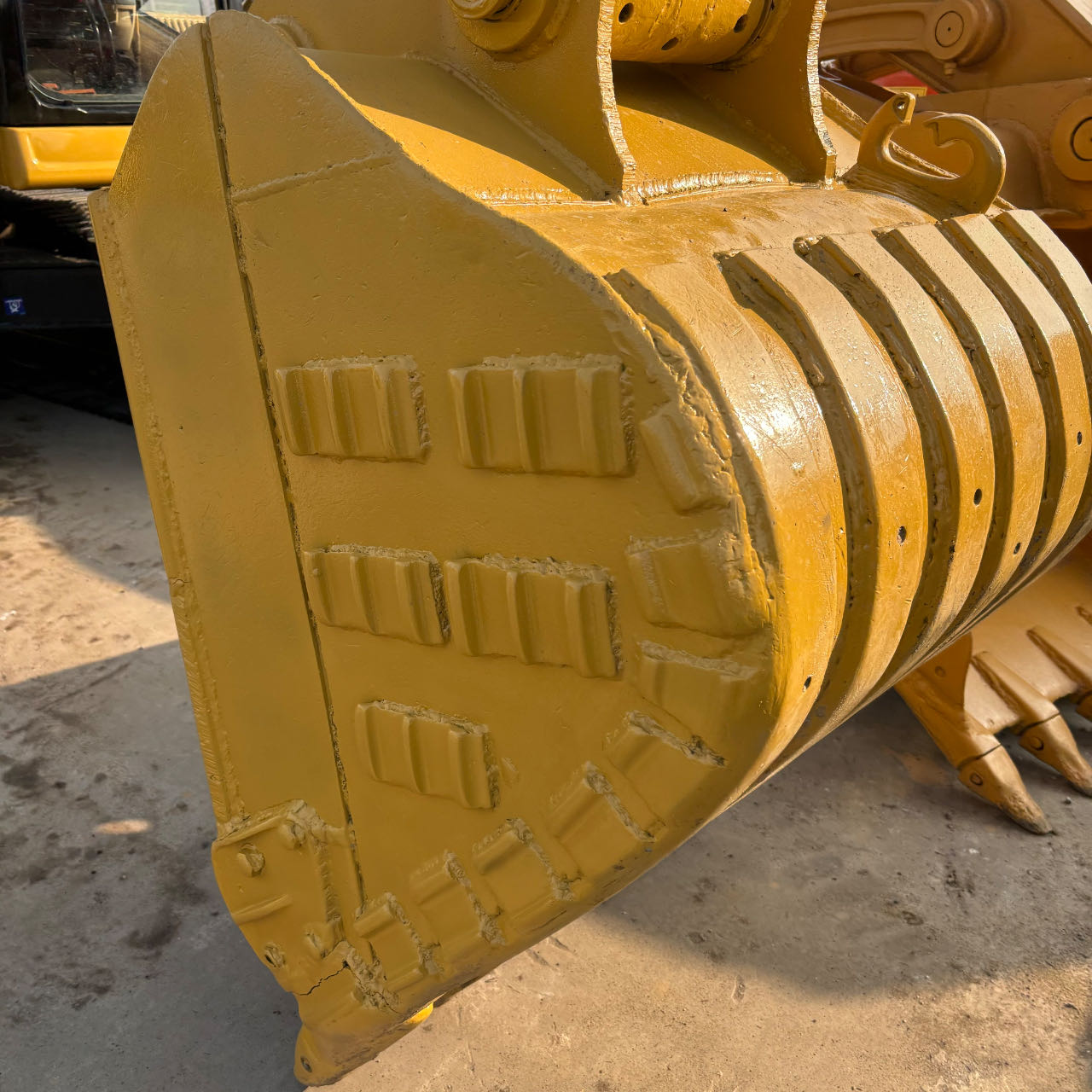 Heavy-duty reinforced bucket designed for maximum Cat 320 excavator specs capacity