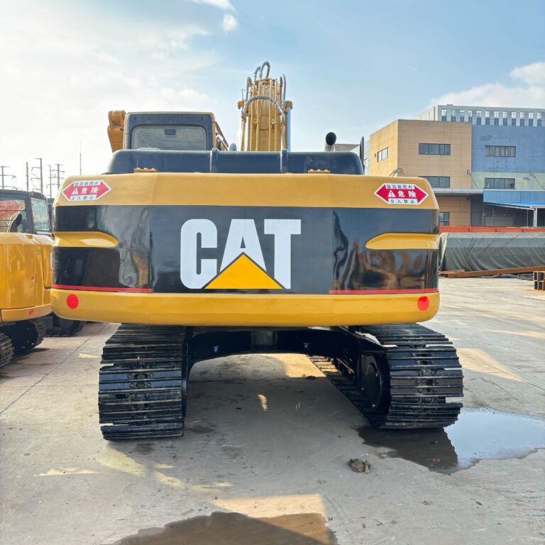 Rear view of a used Cat 320 excavator with original counterweight and heavy-duty undercarriage